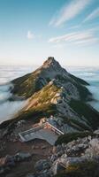 A view of a mountain with a bench on top photo