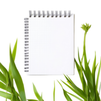 A fresh spring notepad surrounded by green leaves on a clean, transparent background for creative inspiration, spring notepad front view, file of isolated object on transparent background png