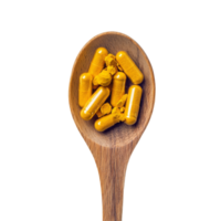 Turmeric capsules nestled in a wooden spoon against a clean transparent background, highlighting natural nutrients, Turmeric Capsule in wood spoon on transparent background png
