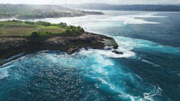 Drone view with blue ocean and rocks coastline on Nusa Lembongan island video