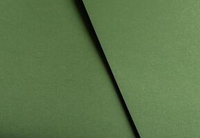 Olive green paper background with a subtle texture and organic depth. Muted moss and forest tones photo