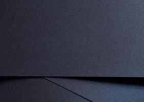 Deep navy blue paper background with a smooth matte texture and subtle geometric lines. Rich photo