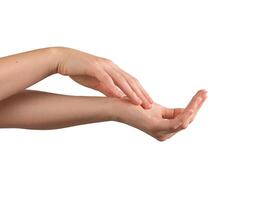 Female hands gently applying moisturizer, with a focus on healthy, well-groomed nails and smooth photo