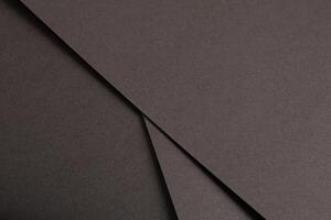 Dark espresso brown paper background with a smooth matte texture and subtle geometric lines photo