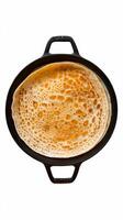 Dosa ghee roast dosafamous south indian breakfast item which is made in caste iron pan in traditional way and arranged on a white base on a white background isolated photo