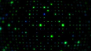 A green and blue dot pattern is shown on a black background video