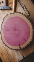 A slice of wood with a pink stain on it photo