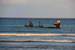 Sun Rising Over the Remains of a Shipwreck photo