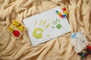 Children's Creativity Displayed Through Handprint Artwork on Soft Background photo