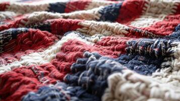 Close-up of a woven textile with red, white, and blue threads. Handmade fabric with intricate textures and a rustic photo