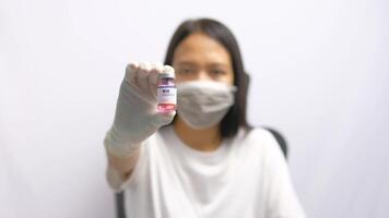 Close-up of a Hand Holding a B12 Vitamin Injection Vial video