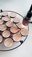 Laser removal round wooden boards with a list of months on a white background photo