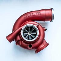 Repr red turbocharger turbine of car isolated on white background photo