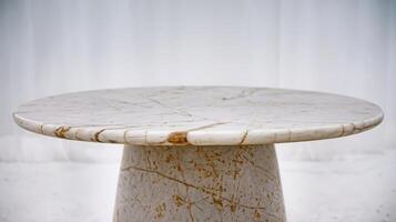 Empty top of white marble stone table on white background can be used for product display photo