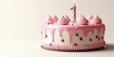 Celebration cake with pink frosting for first birthday with a candle photo