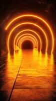 Unique underground tunnel illuminated by bright orange lights creating captivating reflections on the floor photo