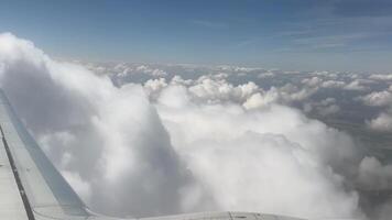 The sky is filled with clouds and the sun is shining through them video