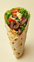Delicious steak wrap filled with fresh vegetables and creamy sauce ready to be enjoyed photo