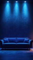 Modern blue sofa in a dimly lit room with blue lighting creating a serene atmosphere during evening hours photo