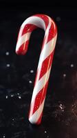 Sweet red and white candy cane with sparkling finish for festive decorations during holiday season photo