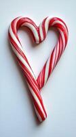 Heart-shaped candy cane representing festive cheer during winter holidays photo