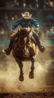 Cowboy riding an energetic horse during a rodeo event at dusk, showcasing skill and excitement in a vibrant atmosphere photo