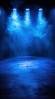 Dramatic blue lighting enhances an atmospheric performance space with fog and shadows for captivating events photo