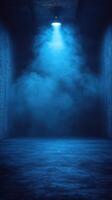 Dark corridor illuminated by a blue light with fog creating an atmospheric effect photo