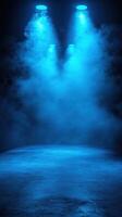 Dramatic blue stage lighting enhances atmosphere for performance in a fog-filled venue photo