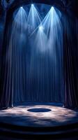 Dramatic stage setup with spotlight and curtains in a dimly lit theater photo