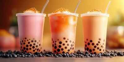 Refreshing bubble tea trio featuring vibrant flavors with tapioca pearls on a warm evening photo