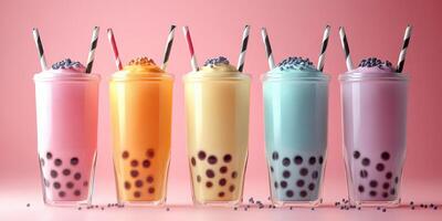 Colorful bubble tea drinks arranged in a stylish display on a pink background for a refreshing treat photo