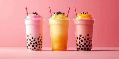 Colorful bubble tea drinks displayed against a vibrant pink background, showcasing variety and freshness photo