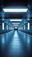 Modern underground corridor features bright lights and a sleek, reflective floor creating an atmospheric space for urban exploration photo