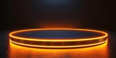 Circular platform illuminated by soft orange light in a dark environment suitable for presentations or displays photo