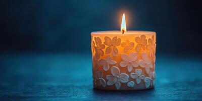 Beautifully carved candle glows softly in a serene atmosphere during evening hours photo