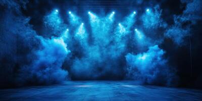 Stage illuminated by blue lights and fog creates an atmospheric performance setting for artists at night photo