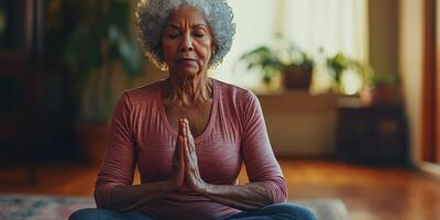 Senior woman practicing meditation in a serene indoor environment during the afternoon photo