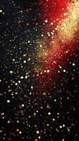 Glittering gold and red particles swirl in an artistic display against a dark background during a festive celebration photo