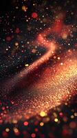 Glowing particles create a mesmerizing abstract design in vibrant red, gold, and black tones during evening hours photo