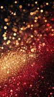 Sparkling gold and red bokeh background creates festive atmosphere for celebrations and events photo