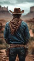 Cowboy standing in a desert landscape with dramatic clouds and rock formations during the late afternoon photo