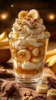 Delicious banana parfait served with whipped cream and granola on a rustic wooden table photo