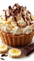 Delicious dessert featuring creamy whipped topping, banana slices, and rich chocolate in a crisp pastry shell photo