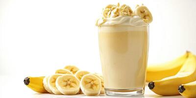 Perfectly blended banana smoothie topped with fresh banana slices and whipped cream for a refreshing treat photo