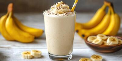 Delicious banana smoothie served with fresh bananas and toppings in a bright kitchen setting photo