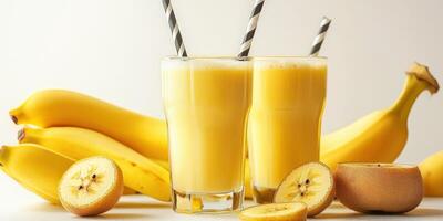 Refreshing banana smoothie served with ripe bananas in a bright kitchen setting during the afternoon photo