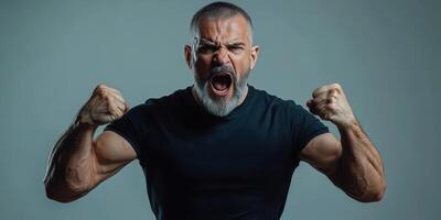 Muscular man expressing intense emotion during fitness session in studio photo