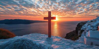 Stunning sunset over the sea with a wooden cross on a hillside in Santorini highlighting the beauty of nature photo