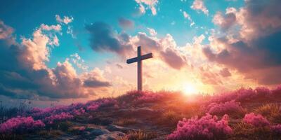 Sunset over a hill with a wooden cross surrounded by blooming flowers and vibrant clouds photo